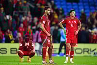 | Photo: David Davies/PA via AP : World Cup Qualifier Soccer Match: Wales vs Belgium