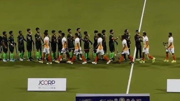 Screengrab/Ashley Morrison Media YouTube : India, Pakistan players exchange high fives before the start of their Sultan of Johor Cup match in Malaysia.