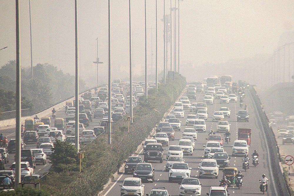 Vehicles move on Delhi-Gurugram Expressway amid morning haze