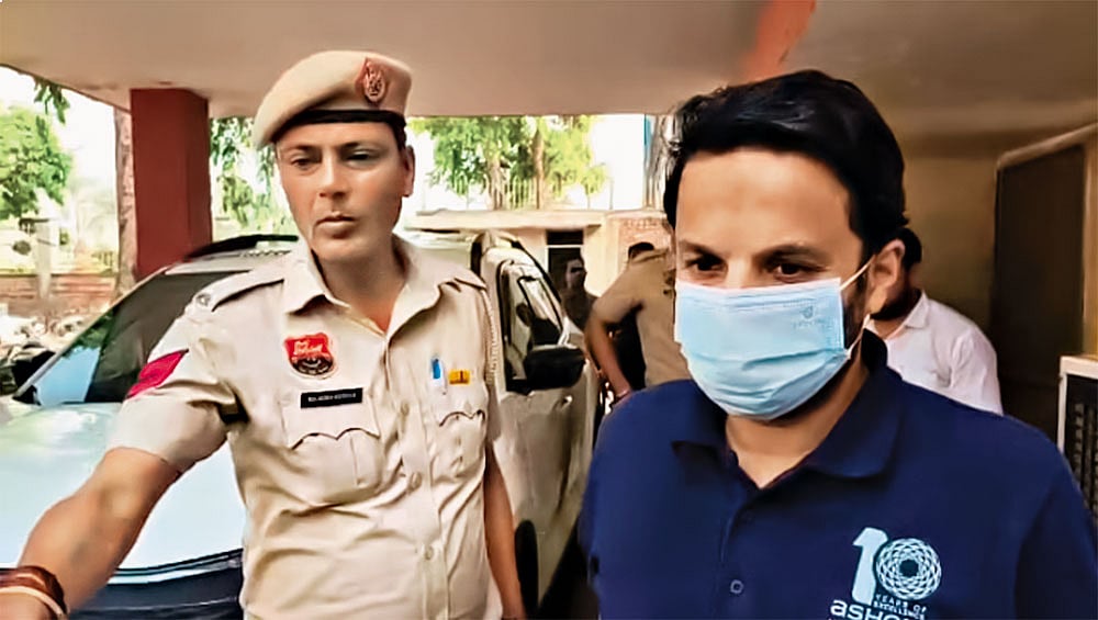 Ashoka University professor Ali Khan Mahmudabad being escorted by police personnel after his arrest