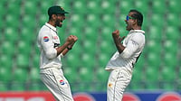 Pakistan's Noman Ali celebrates with Shan Masood