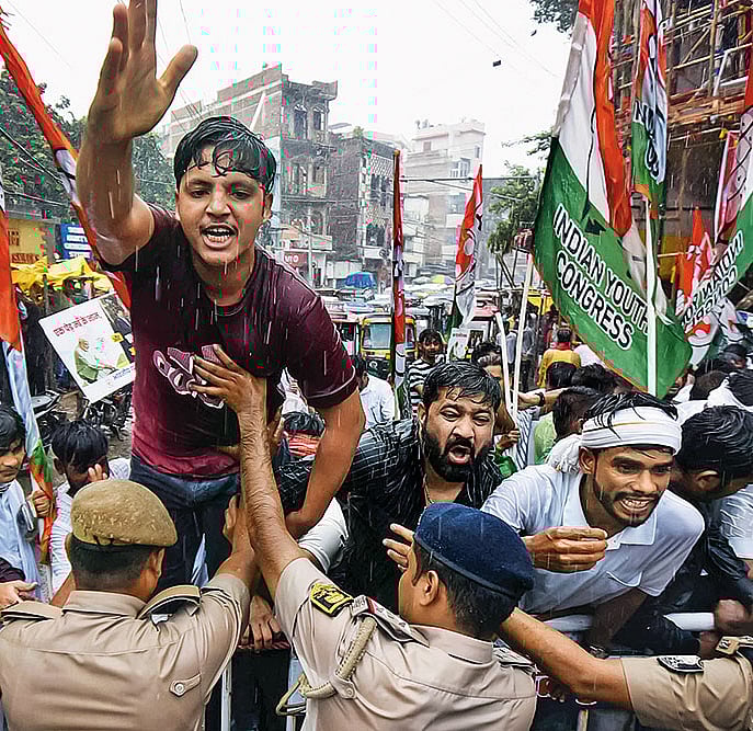 | Photo: Imago : Shaping the Political Narrative: Police personnel stop Youth Congress workers during a protest in Patna on September 23. 