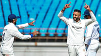 PTI : Rajkot: Saurashtra's Dharmendrasinh Jadeja celebrates after the wicket of Karnataka's Devdutt Padikkal during the Ranji Trophy cricket match between Karnataka and Saurashtra, at Niranjan Shah Stadium in Rajkot, Wednesday, Oct. 15, 2025.