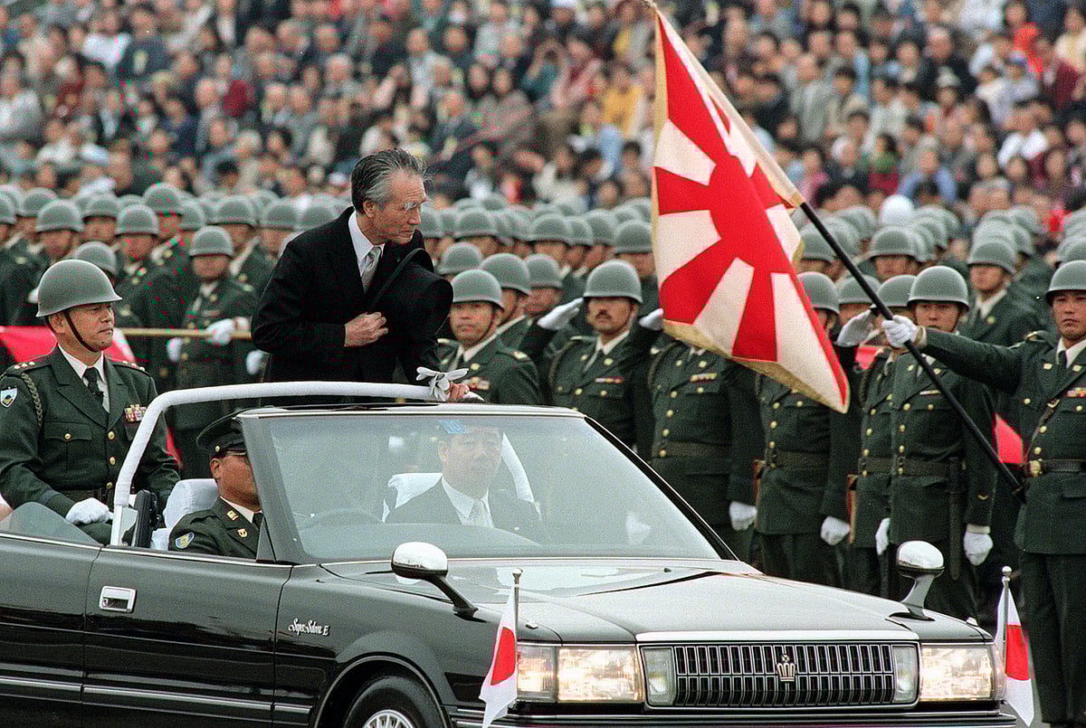 AP : 
Former Japanese Prime Minister Tomiichi Murayama attends a ceremony to review Japan's Self-Defense Forces at its Camp Asaka in Tokyo in October 1994. 