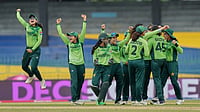 | Photo: AP/Eranga Jayawardena : Pakistan's team members celebrate the dismissal of England's Sophia Dunkley during the ICC Women's Cricket World Cup match between England and Pakistan at Premadasa Stadium in Colombo, Sri Lanka, Wednesday, Oct, 15, 2025. 