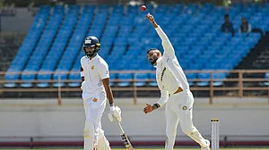 | Photo: PTI : Ranji Trophy 2025-26: Dharmendrasinh Jadeja in action as Saurashtra take on Karnataka.