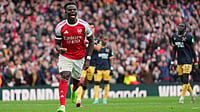 Photo: AP/Kirsty Wigglesworth : EPL: Arsenal's Bukayo Saka celebrates a goal against West Ham.