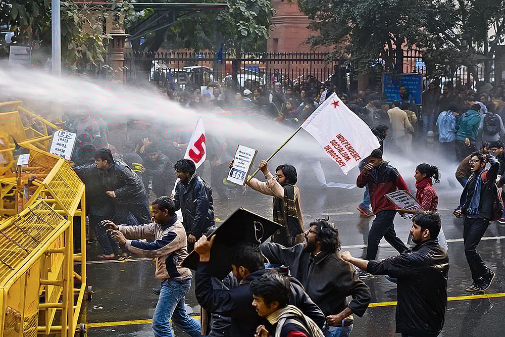 | Photo: IMAGO : Student Activism: Police use water canons on students during a protest to demand the resignation of the Hyderabad University vice-chancellor over the suicide of Dalit scholar Rohith Vemula on January 18, 2016, in New Delhi. 