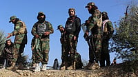 AP : Afghan servicemen guard along the border in the Zazai Maidan district of Khost province, Afghanistan, Sunday, Oct. 12, 2025, after overnight clashes with Pakistan's forces.