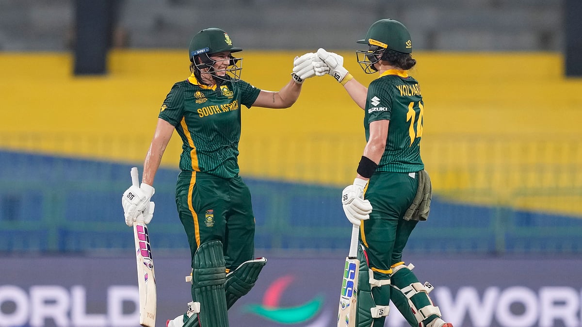 (AP Photo/Eranga Jayawardena) : South Africa's captain Laura Wolvaardt, right, and Tazmin Brits celebrate after winning the ICC Women's Cricket World Cup match between South Africa and Sri Lanka at Premadasa Stadium in Colombo, Sri Lanka, Friday, Oct, 17, 2025.