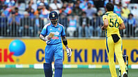 David Woodley/AAPImage via AP : Virat Kohli, left, walks off after being dismissed by Mitchell Starc during the one-day international cricket match between Australia and India in Perth.