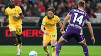 AP/Luca Bruno : Luka Modric, center, pases the ball past Fiorentina's Hans Nicolussi Caviglia during a Serie A soccer match between AC Milan and Fiorentina in Milan.