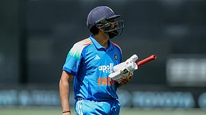 AP/DAVID WOODLEY : Rohit Sharma walks back after dismissal in 1st ODI