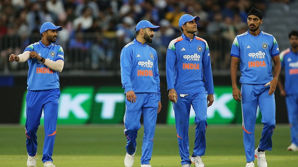 AP/DAVID WOODLEY : Indian players make their way to the drinks station