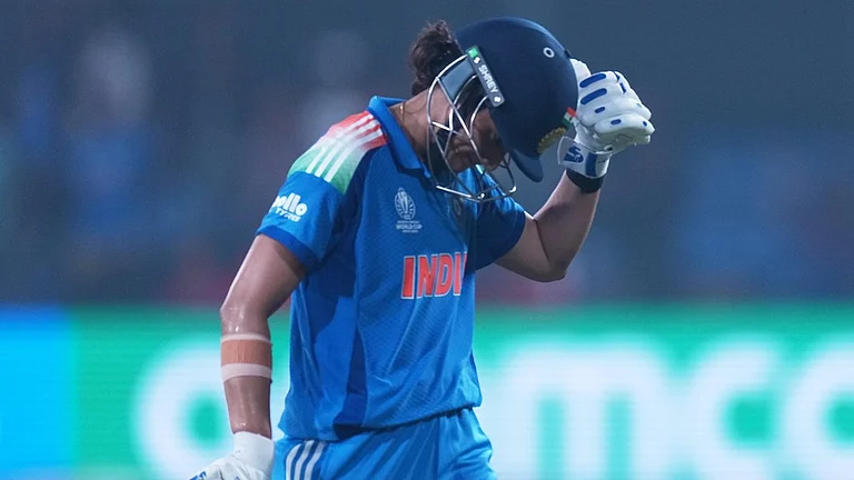 Smriti Mandhana reacts as she leaves the field after losing her wicket during the ICC Women's Cricket World Cup match between India and England in Indore. - AP