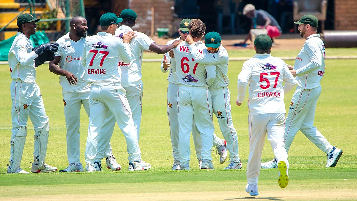 X/Zimbabwe Cricket : Zimbabwe players celebrate an Afghanistan wicket on Day 1 of the one-off Test in Harare.