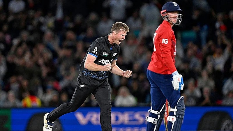 Andrew Cornaga/Photosport via AP : Jimmy Neesham, left, celebrates the wicket of Harry Brook during the first T20 international between New Zealand and England in Christchurch.