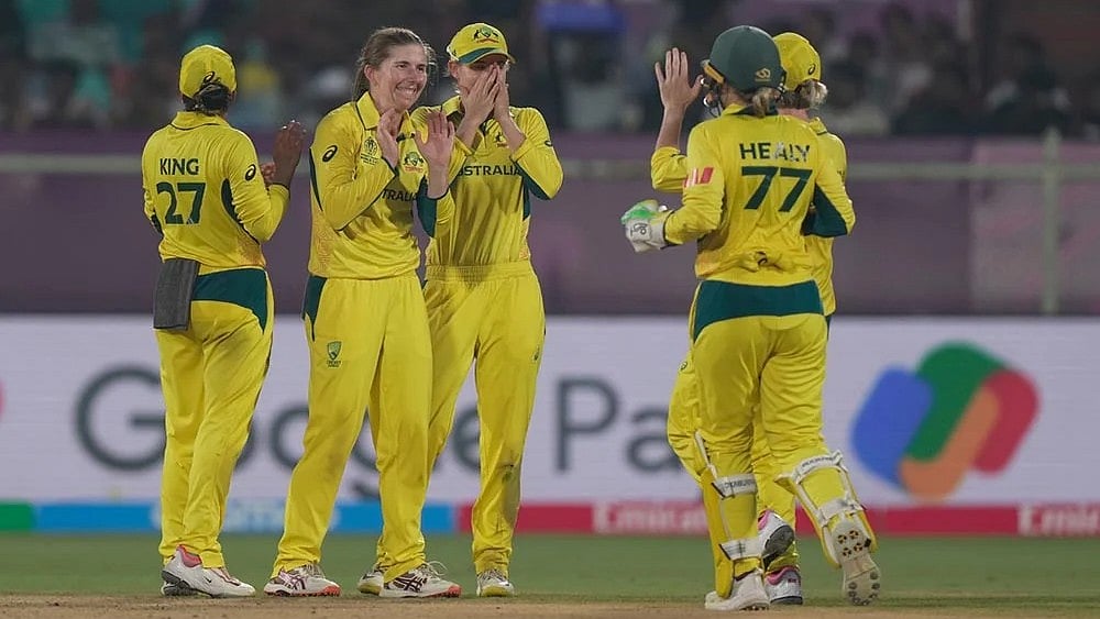 Australia celebrating a wicket during their Women's World Cup match against England   - | Photo: AP/Mahesh Kumar A.