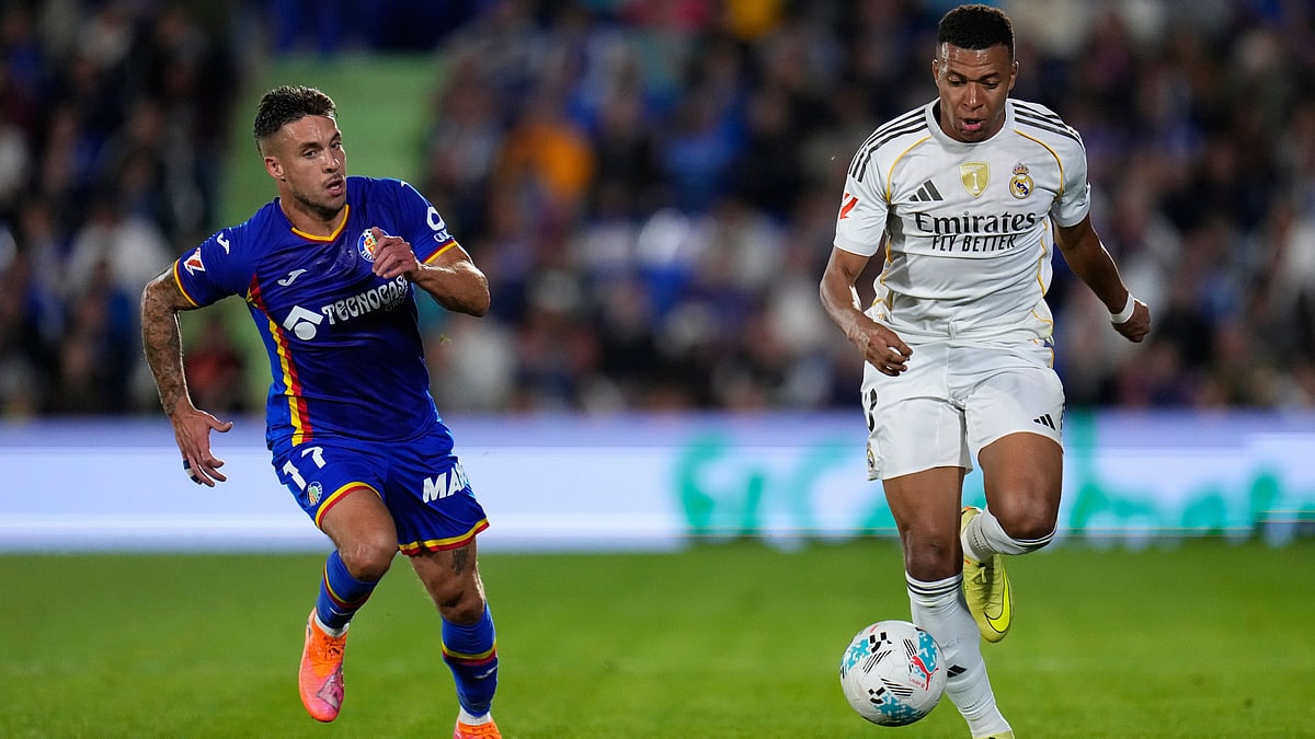 | Photo: AP/Manu Fernandez : Real Madrid's Kylian Mbappe in action by Getafe's Kiko Femenia during a La Liga soccer match between Getafe and Real Madrid in Getafe, Spain, Sunday, Oct. 19, 2025.