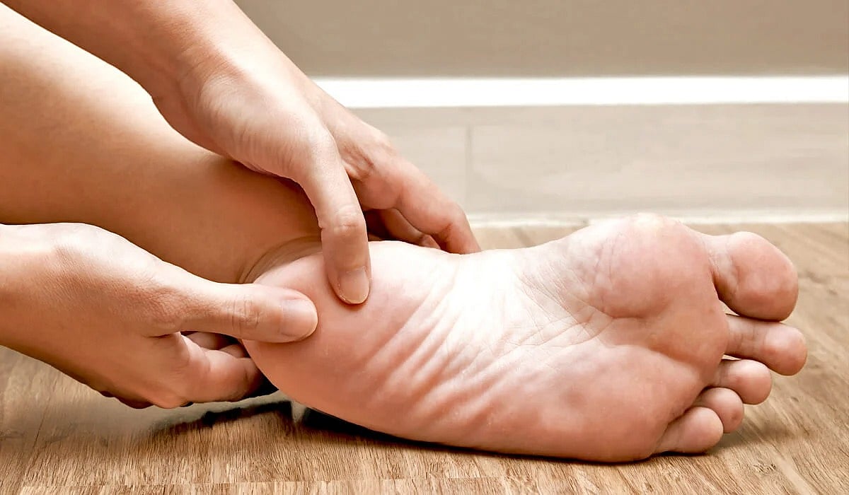 a person pressing on their foot