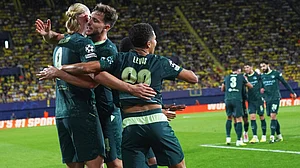 | Photo: AP/Alberto Saiz : Manchester City's Erling Haaland, left, celebrates with teammates after scoring his side's opening goal during the Champions League opening phase soccer match between Villarreal and Manchester City in Villarreal, Spain, Tuesday, Oct. 21, 2025.