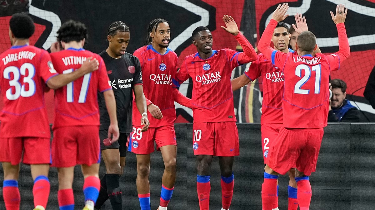 | Photo: AP/Martin Meissner : PSG's Ousmane Dembele celebrates with his teammates after scoring his side's sixth goal during a Champions League opening phase soccer match between Bayer Leverkusen and Paris Saint-Germain in Leverkusen, Germany, Tuesday, Oct. 21, 2025.