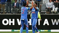Photo: AAPImage/David Woodley via AP : India's Ashdeep Singh celebrates with teammate Harshit Rana after he caught Travis Head during the one day international cricket match between Australia and India in Perth Australia, Sunday, Oct. 19, 2025. 