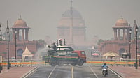 Is There Any Solution To Delhi’s Pollution? - PTI  : New Delhi: An anti-smog gun sprays water droplets to curb air pollution, with Rashtrapati Bhavan in the backdrop, as air quality deteriorates across northern India, in New Delhi, Tuesday, Oct. 21, 2025.