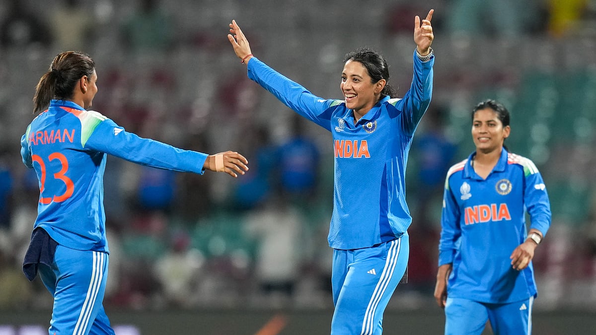 PTI : India's captain Harmanpreet Kaur (left) celebrates the wicket of New Zealand's Jess Kerr with teammate Smriti Mandhana (centre) during their ICC Women's World Cup ODI match at the DY Patil Stadium in Navi Mumbai.
