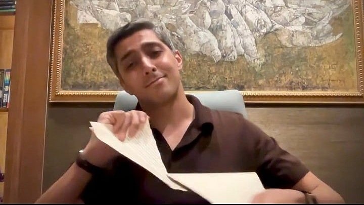 Pakistan Super League side Multan Sultans' owner Ali Tareen tearing up the legal notice from PCB. - | Photo: Screenshot/X
