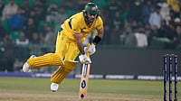 | Photo: AP/K.M. Chaudary : Australia's Glenn Maxwell consoles his balance after playing a shot for boundary during the ICC Champions Trophy cricket match between Australia and England, in Lahore, Pakistan, on Feb. 22, 2025. 