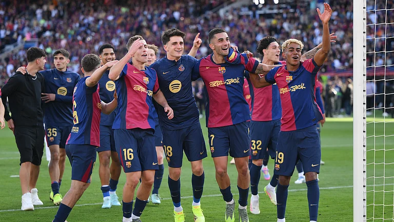 Barcelona celebrate their 4-3 win over Real Madrid in May - null