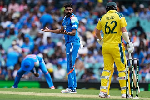India's Mohammed Siraj, center, gestures after bowling to Australia's Travis Head during their One Day International cricket match in Sydney, Australia.