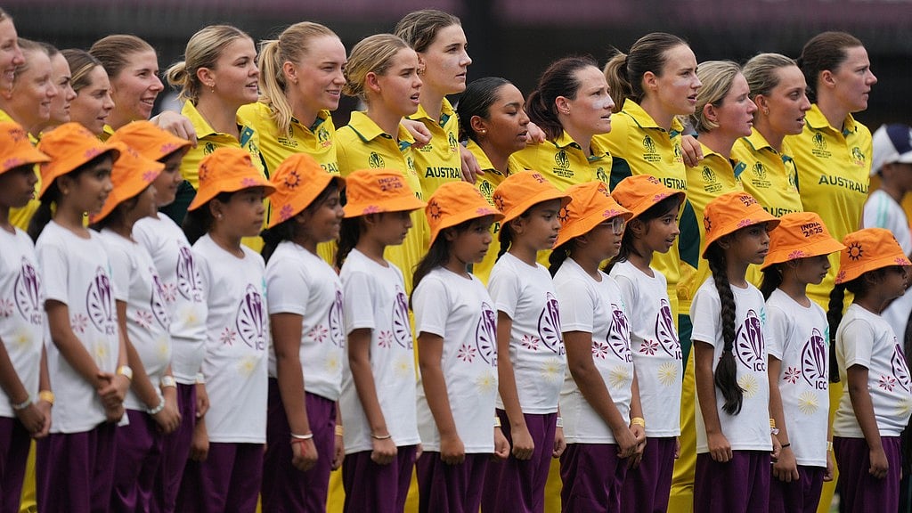 AP : Australia's players stand for their national anthem during the ICC Women's Cricket World Cup match between Australia and South Africa in Indore.
