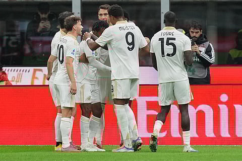 Pisa players celebrate after a goal during the Serie A soccer match between AC Milan and Pisa in Milan, Italy.