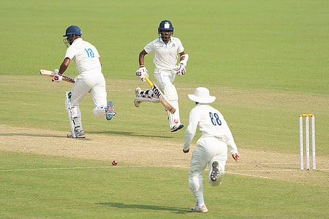 Bengal's Abhimanyu Easwaran and Sudip Chatterjee run between the wickets during the first day of the Ranji Trophy cricket match between Bengal and Gujarat, at Eden Gardens, in Kolkata, West Bengal.