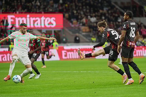 AC Milan's Alexis Saelemaekers shoots during the Serie A soccer match between AC Milan and Pisa in Milan, Italy.