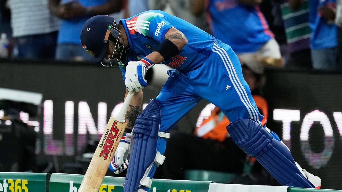(AP Photo/Rick Rycroft) : India's Virat Kohli touches the gourd as he comes on to bat against Australia during their One Day International cricket match in Sydney, Australia, Saturday, Oct. 25, 2025.