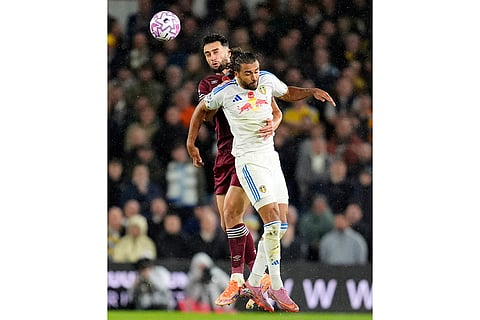 West Ham United's Max Kilman, rear, and Leeds United's Dominic Calvert-Lewin in action during the English Premier League soccer match between Leeds United and West Ham United at Elland Road, Leeds, England.