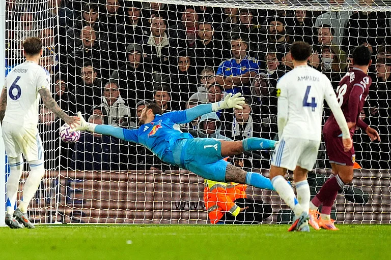 Leeds United's goalkeeper Lucas Perri dives in vain as West Ham United's Mateus Fernandes, right, scores their side's first goal during the English Premier League soccer match between Leeds United and West Ham United at Elland Road, Leeds, England. - | Photo: Danny Lawson/PA via AP