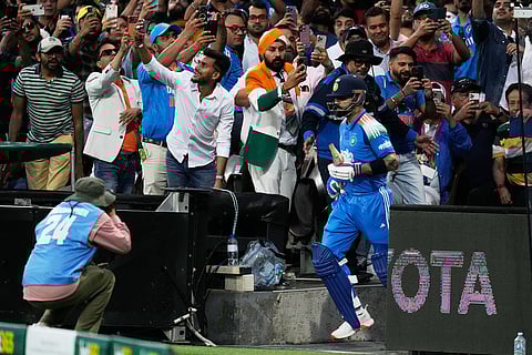 India's Virat Kohli runs out to bat against Australia during their One Day International cricket match in Sydney, Australia.