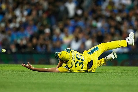 Australia's Josh Hazlewood is unable to catch a ball to dismiss India's Rohit Sharma during their One Day International cricket match in Sydney, Australia.