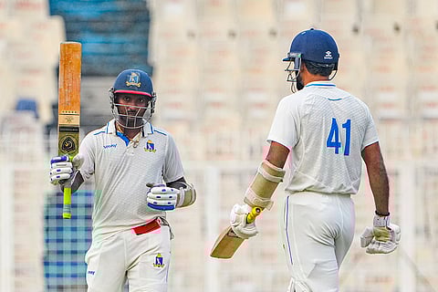 Bengal's Sumanta Gupta celebrates his half century on day one of a Ranji Trophy cricket match between Bengal and Gujarat, at the Eden Gardens, in Kolkata, West Bengal.