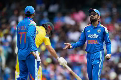India's Virat Kohli, right, talks with teammate India's Shubman Gill during their One Day International cricket match against Australia in Sydney, Australia.