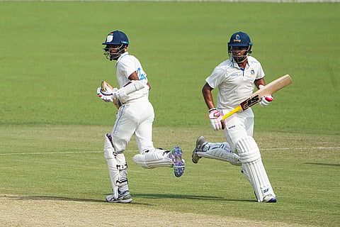 Bengal's Abhimanyu Easwaran and Sudip Chatterjee run between the wickets during the first day of the Ranji Trophy cricket match between Bengal and Gujarat, at Eden Gardens, in Kolkata, West Bengal.
