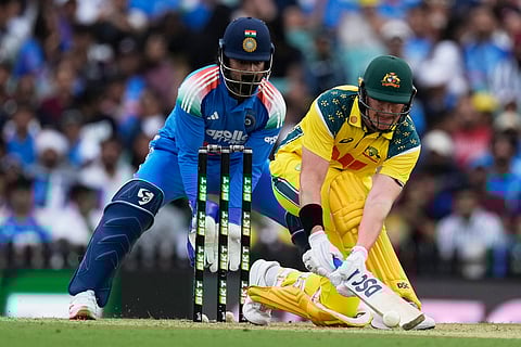 Australia's Matt Renshaw, right, plays a ramp shot in front of India's KL Rahul during their One Day International cricket match in Sydney, Australia.