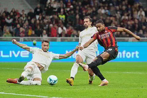 Pisa's Antonio Caracciolo blocks AC Milan's Ruben Loftus-Cheek during the Serie A soccer match between AC Milan and Pisa in Milan, Italy.