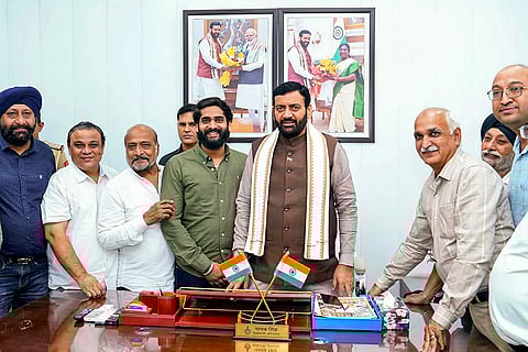 Haryana Chief Minister Nayab Singh Saini with cloth traders from Panipat during a meeting, in Chandigarh. 