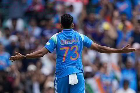 India's Mohammed Siraj celebrates taking the wicket of Australia's Travis Head during their One Day International cricket match in Sydney, Australia.