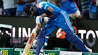 AP : India's Virat Kohli touches the gourd as he comes on to bat against Australia during the third ODI in Sydney.
